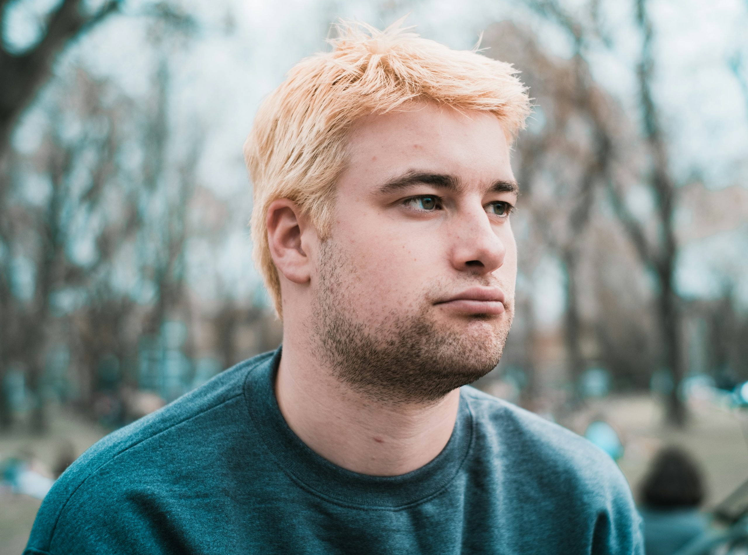 Close-up of a man with a thoughtful expression, representing themes of relational trauma and emotional challenges.